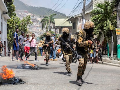 PORT-AU-PRINCE, HAITI - JULY 08:  Citizens take part in a protest near the police station of Petion Ville after Haitian president Jovenel Moïse was murdered on July 08, 2021 in Port-au-Prince, Haiti. Moise was killed and his wife injured during an attack to their home in the nation's capital on Wednesday.  Haiti remains in turmoil as new authorities are still to be defined and assassins identified. (Photo by Richard Pierrin/Getty Images)