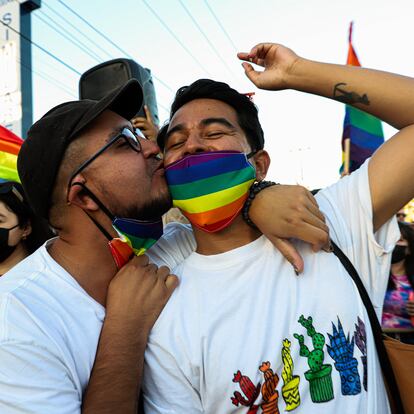 HERMOSILLO, MEXICO - JUNE 26: A couple kisses during a LGBT+ Pride parade on June 26, 2021 in Hermosillo, Mexico. (Photo by Luis Gutierrez/ Norte Photo/Getty Images)