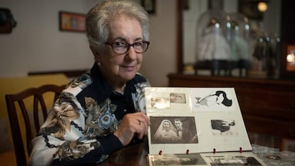 Anna Maria Aguilella in her home in Barcelona with a wedding photo of her parents, who were killed in Manila.