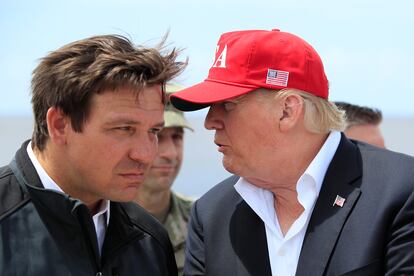 President Donald Trump talks to Florida Gov. Ron DeSantis