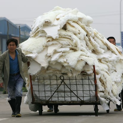 JIAOZUO, HENAN - APRIL 25:  People work at Longfeng leather & fur factory on April 25, 2006 in Meng county, Jiaozuo city, Henan province of China. China's sizzling economy grew at a 10.2 percent annual rate in the first quarter of this year, while inflation stayed low and industrial output and retail sales soared, the government announced.  (Photo by Guang Niu/Getty Images)