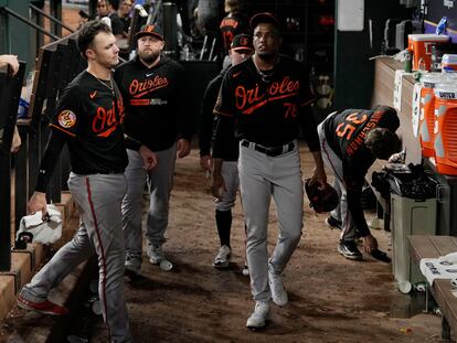 Baltimore Orioles relief pitcher Yennier Cano (78) walks in the dugout after the Texas Rangers defeated the Orioles in Game 3 of a baseball AL Division Series on Tuesday, Oct. 10, 2023, in Arlington, Texas.