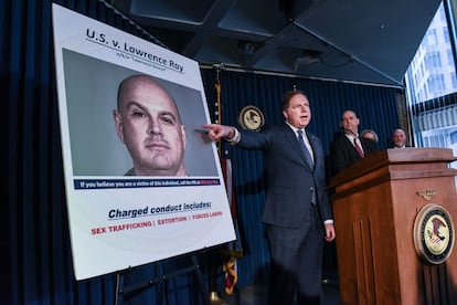 In this file photo taken on February 11, 2020, US Attorney for the Southern District of New York, Geoffrey Berman (C), announces the indictment against Lawrence Ray aka "Lawrence Grecco in New York City.