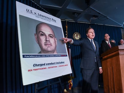 In this file photo taken on February 11, 2020, US Attorney for the Southern District of New York, Geoffrey Berman (C), announces the indictment against Lawrence Ray aka "Lawrence Grecco in New York City.