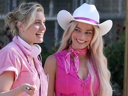 Director Greta Gerwig, with Margot Robbie, both in pink, on the set of 'Barbie.'