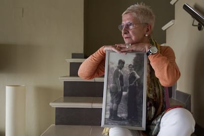 Maixabel Lasa, whose husband was killed by ETA hitmen, poses with a photo of the couple when they were 16 years old.