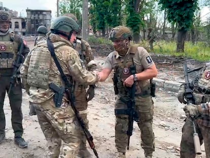 In this grab taken from video released by Prigozhin Press Service on Saturday, May 20, 2023, Yevgeny Prigozhin, the owner of the Wagner Group military company shakes hands with his soldiers, in Bakhmut, Ukraine.