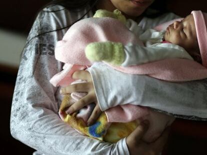 The 11-year old Paraguayan girl with her newborn.