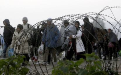 A group of refugees crosses the border between Greece and Macedonia at the weekend.