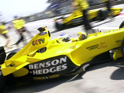 In this file photo taken on May 2, 2003, Italian Jordan-Ford driver Giancarlo Fisichella steers his car in the pits of the Montmelo racetrack near Barcelona before the Catalunya Formula One Grand Prix of Spain.
