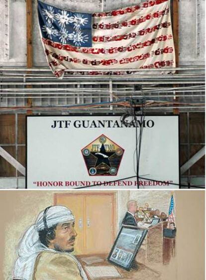 Una bandera de EE UU hecha con huellas de manos decora el centro de prensa en Guantánamo sobre el lema "El honor obliga a defender la libertad". Debajo, un dibujo del juicio contra Salim Hamdan.