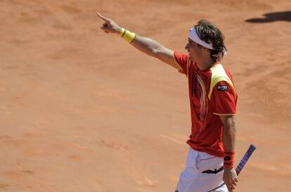 Spain&#039;s David Ferrer celebrates after winning the fourth Davis Cup quarterfinal match against Austrian Jurgen Melzer. 