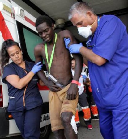 A migrant injured by the barbed border fence.