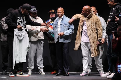 New York City Mayor Eric Adams, center, surrounded by artists, at a hip hop fashion show organized by the Universal Hip Hop Museum, in New York, in February 2023.