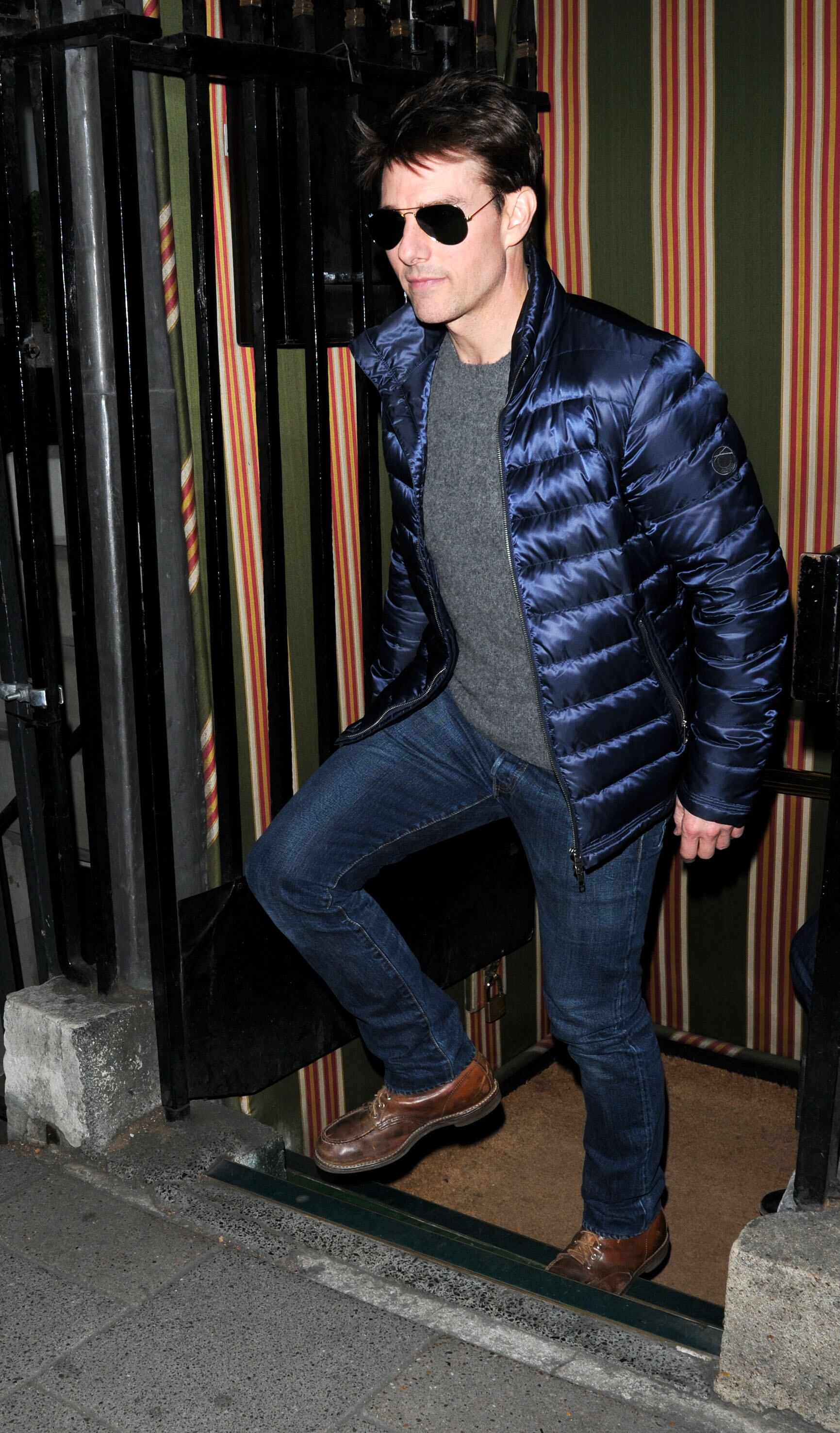 At 50, Cruise kept his style simple and low-risk. Here, I'm hanging out at a London club in a blue puffer jacket, jeans and lace-ups.