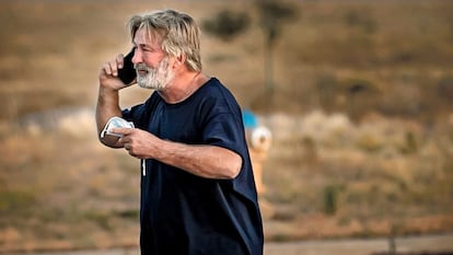 Alec Baldwin speaks on the phone in the parking lot outside the Santa Fe County Sheriff's Office in Santa Fe, N.M., after he was questioned about a shooting on the set of the film "Rust" on the outskirts of Santa Fe, Thursday, Oct. 21, 2021.