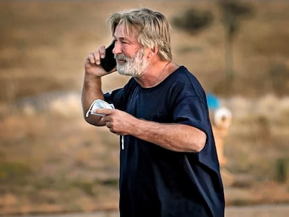 Alec Baldwin speaks on the phone in the parking lot outside the Santa Fe County Sheriff's Office in Santa Fe, N.M., after he was questioned about a shooting on the set of the film "Rust" on the outskirts of Santa Fe, Thursday, Oct. 21, 2021.