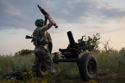 A Ukrainian serviceman of the 3rd Assault Brigade fires a 122mm mortar towards Russian positions at the front line, near Bakhmut, Donetsk region, Ukraine, Sunday, July 2, 2023.