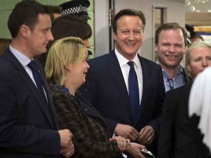 PM David Cameron and party members celebrating preliminary results.