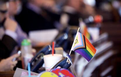 A flag supporting LGBTQ+ rights decorates a desk on the Democratic side of the Kansas House of Representatives during a debate, March 28, 2023