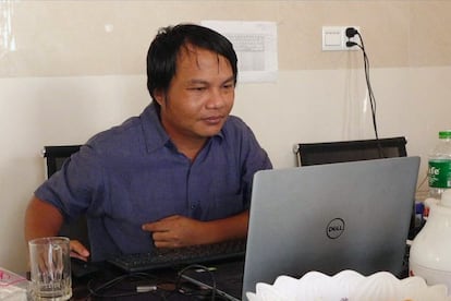 Myanmar photojournalist Sai Zaw Thaike is seen working in this undated photo.