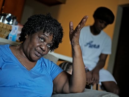Bobbie Boyd talks about this summer's heat in her apartment which she shares with her 15-year-old grandson Jeremiah Williams, right, Wednesday, Aug. 9, 2023, in Fayetteville, Ark.