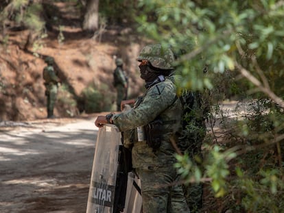 Special forces of the Mexican Army stand guard on a road in Aguililla.