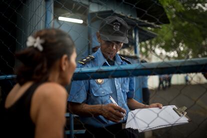 A woman waits at the entrance to El Chipote prison in Managua