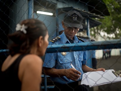 A woman waits at the entrance to El Chipote prison in Managua