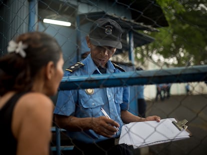A woman waits at the entrance to El Chipote prison in Managua, in July 2018.