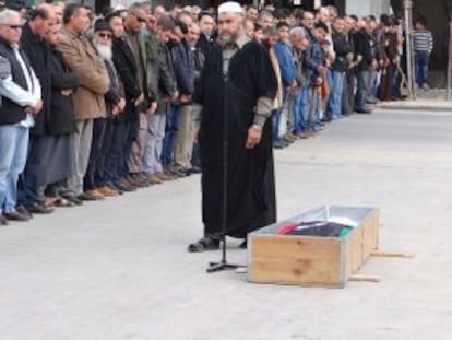 Mourners pay tribute to brigade commander Tareq Shanina in Misrata on December 23.