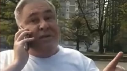O desembargador Eduardo Almeida Prado Rocha de Siqueira fala ao telefone com o secretário da Segurança de Santos, Sérgio Del Bél, enquanto é autuado.
