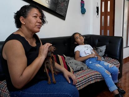 Valerie Torres listens as her mother Francys Brito speaks during an interview in their home in Caracas, Venezuela, on Sunday, February 26, 2023.