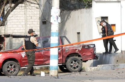 Officers inspect the scene after an attack against police in Guamote, Ecuador, on November 1, 2022.