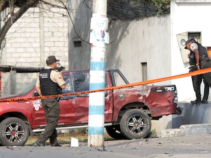 Officers inspect the scene after an attack against police in Guamote, Ecuador, on November 1, 2022.