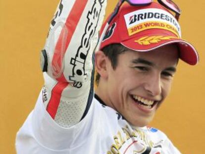 Marc M&aacute;rquez celebrates his title after finishing third at Cheste on Sunday.