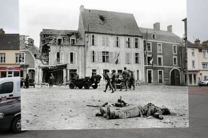 Uma patrulha norte-americana passa diante do cadáver de um soldado alemão, em primeiro plano, na praça do mercado de Trevières, em 15 de junho de 1944.