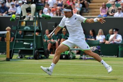 Ferrer devuelve una bola ante Dodig.