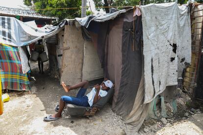 A woman rests at a shelter for displaced people in June 2024.  