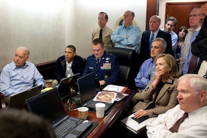 In this May 1, 2011 file image released by the White House and digitally altered by the source to diffuse the paper in front of Secretary of State Hillary Clinton, President Barack Obama and Vice President Joe Biden, along with members of the national security team, receive an update on the mission against Osama bin Laden in the Situation Room of the White House in Washington.