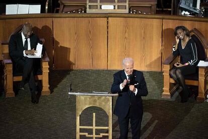 US Senator Raphael Warnock (D-GA), church pastor, and Reverend Chelsea D. Waite listen while US President Joe Biden delivers a sermon at Ebenezer Baptist Church in Atlanta, Georgia, on January 15, 2023, the eve of the national holiday honoring civil rights leader Martin Luther King, Jr.