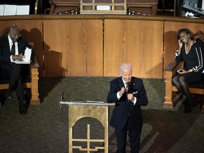 US Senator Raphael Warnock (D-GA), church pastor, and Reverend Chelsea D. Waite listen while US President Joe Biden delivers a sermon at Ebenezer Baptist Church in Atlanta, Georgia, on January 15, 2023, the eve of the national holiday honoring civil rights leader Martin Luther King, Jr.