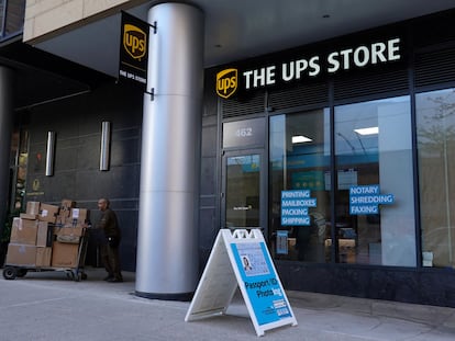 A delivery person exits a United Parcel Service (UPS) Store in Manhattan, New York City, U.S., May 9, 2022.