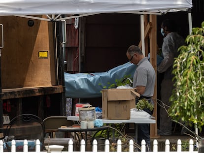 Crime laboratory officers remove items as they search the home of Gilgo Beach murders suspect Rex Heuermann in Massapequa Park, New York, on July 18, 2023.