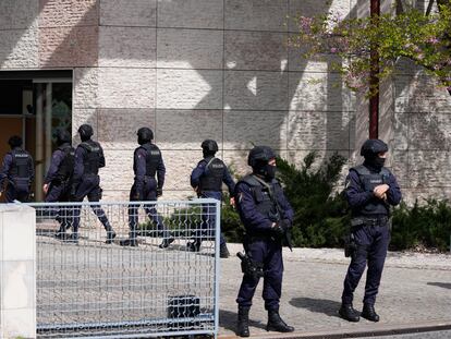 Police officers stand at the main entrance of an Ismaili Muslim center in Lisbon, Portugal, on March 28, 2023.