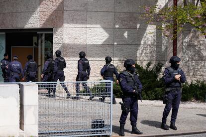 Police officers stand at the main entrance of an Ismaili Muslim center in Lisbon, Portugal, on March 28, 2023.