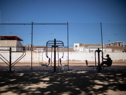 A young man does sports on an exercise machine in Linares, Spain.