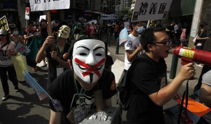 Manifestantes de Macao piden sufragio universal.