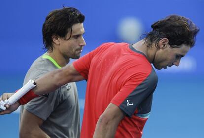 Ferrer y Nadal abandonan la cancha tras el partido. 