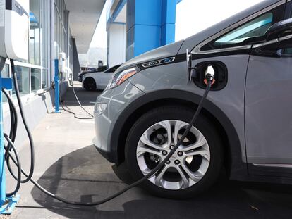 A Chevrolet Bolt EV sits parked at a charging station at Stewart Chevrolet on April 25, 2023 in Colma, California.